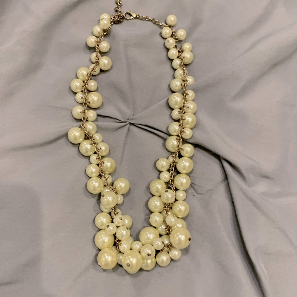 Elegant Cream Pearl Necklace with adjustable length clasp.